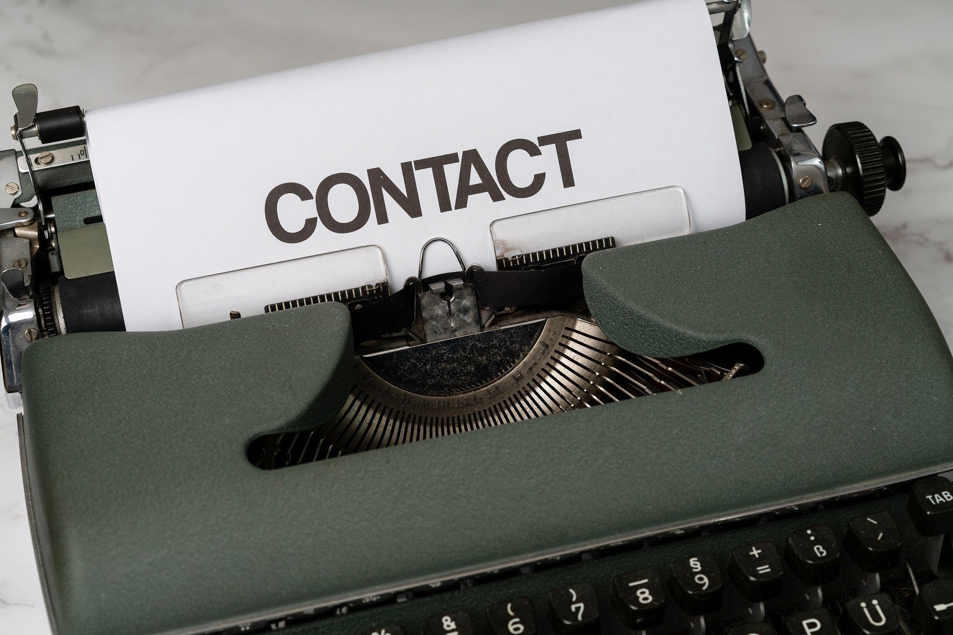Typewriter showing contact link